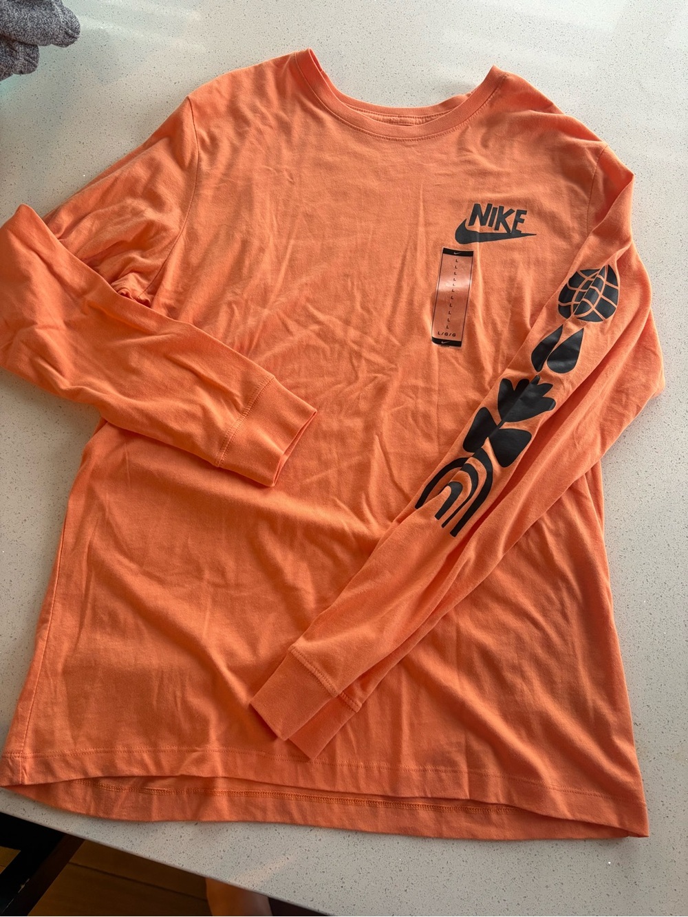 Nike Menβs Long-Sleeve Graphic Tee - Orange with Black Print